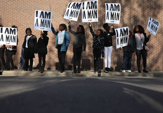 MEMPHIS, TN - APRIL 04: Children from Promise Academy Spring Hill hold 'I Am A Man' signs, in reference to the sanitation workers strike in 1968, as they participate in an event to mark the 50th anniversary of Dr. Martin Luther King Jr.'s assassination April 4, 2018 in Memphis, Tennessee. American civil rights leader King was killed on April 4, 1968 while supporting a sanitation workers strike in Memphis. (Photo by Joe Raedle/Getty Images)