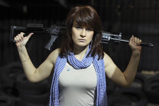 FILE - In this Sunday, April 22, 2012 filer, Maria Butina, a gun-rights activist, poses for a photo at a shooting range in Moscow, Russia. Accused of working as an undeclared foreign agent in the U.S., Butina is fast becoming a cause celebre at home. Russian government rhetoric portrays Butina, accused of working as an undeclared foreign agent in the U.S., as a martyr to U.S. paranoia and a victim of poor conditions in the jail where she's being held pending trial. (AP Photo/Pavel Ptitsin, File)